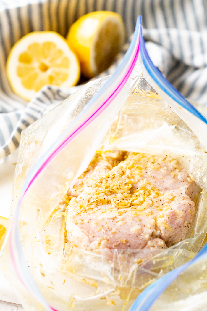 Lemon Rosemary Pork Chops in a bag to marinate. 