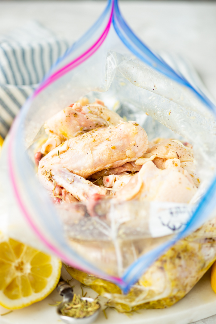 A bag of chicken with lemon rosemary marinade. 