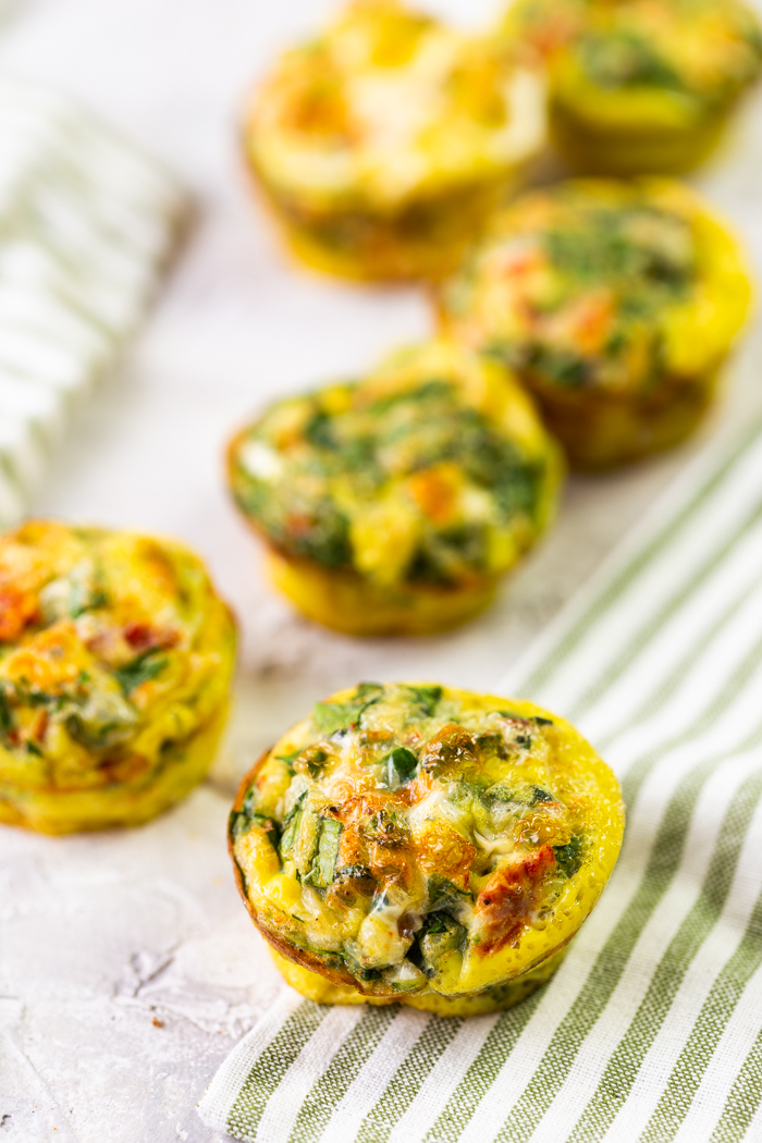 Egg muffins on a surface with a linen