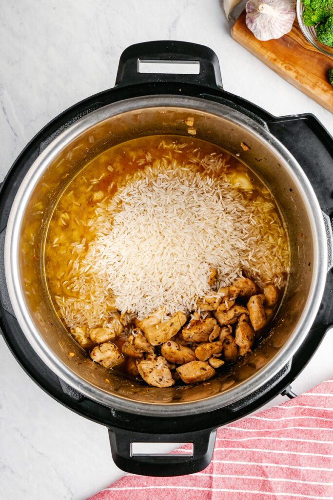 Add the other ingredients to the instant pot for broccoli chicken and rice