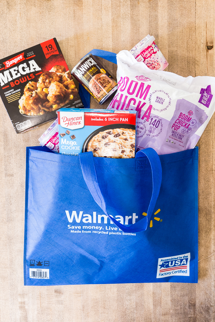A walmart bag with food coming out the top of it
