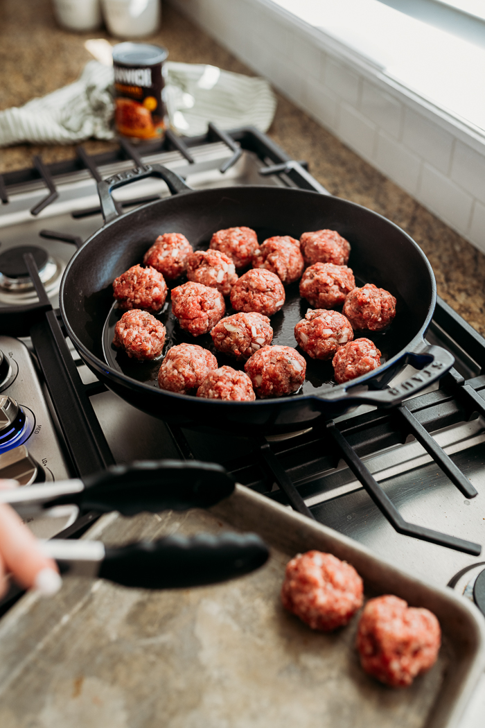 A skillet browning meatballs for manwich sloppy joe meatball subs