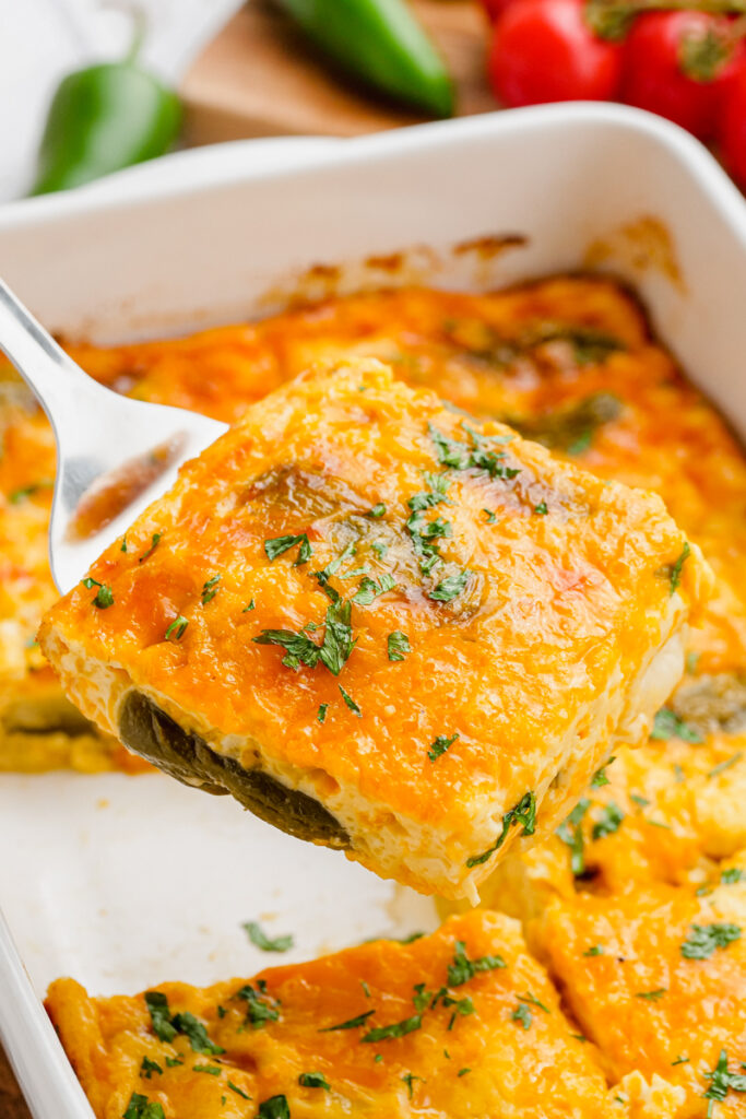 a piece of baked chiles rellenos with the scoop on a spoon