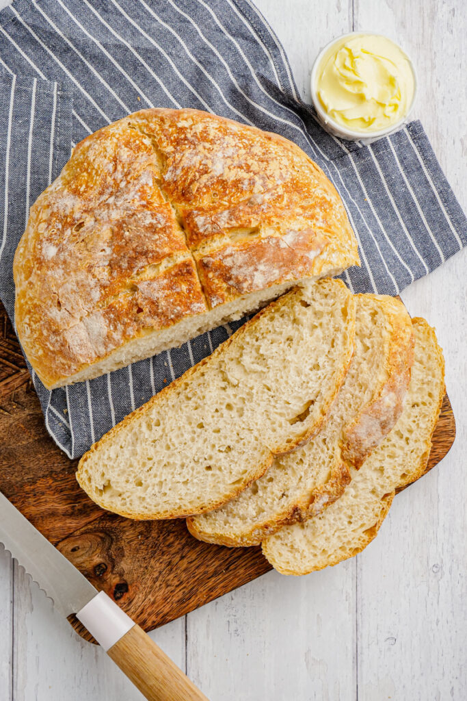 beer bread being cut op cutting board
