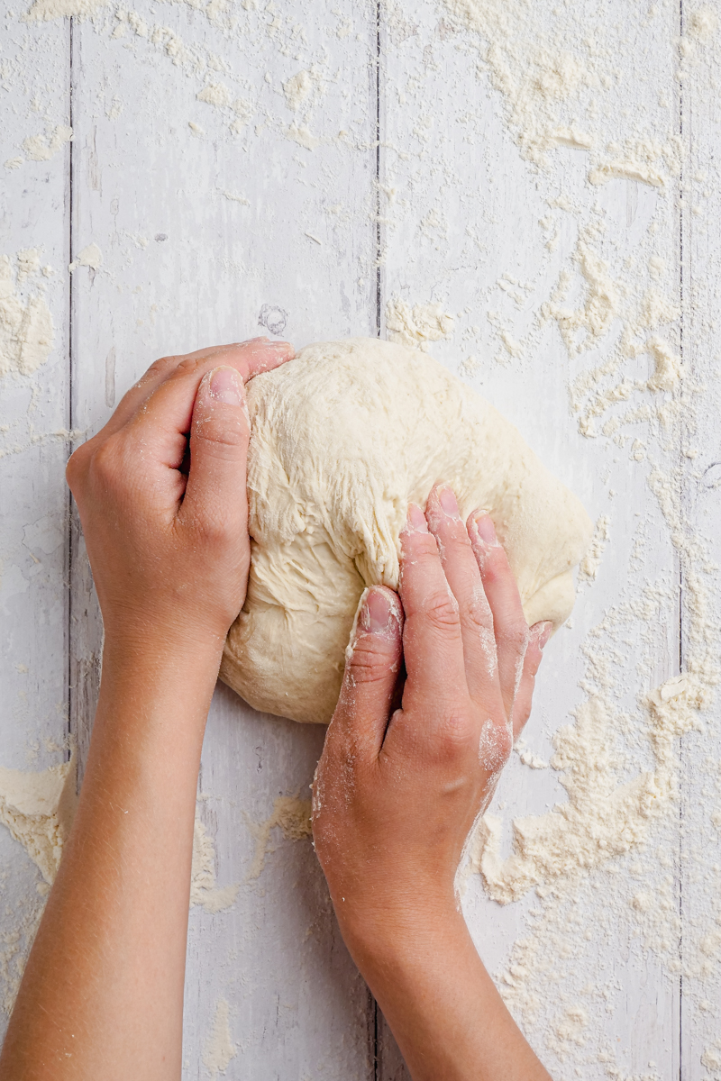 hands kneading the bread