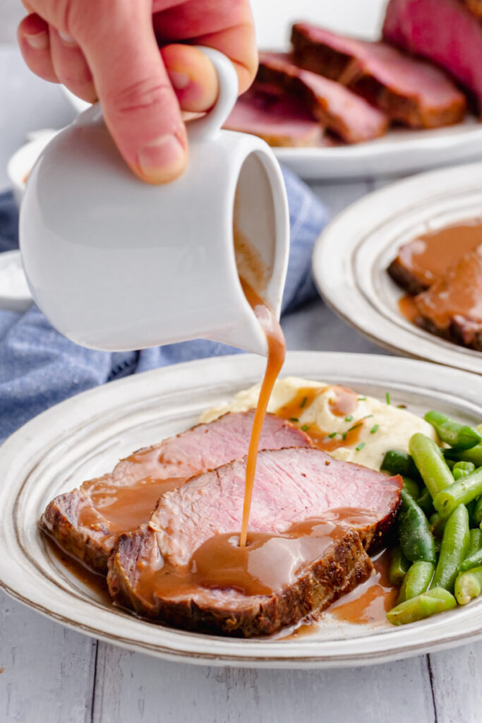 gravy pouring onto meat