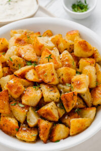 a plate full of crispy potatoes