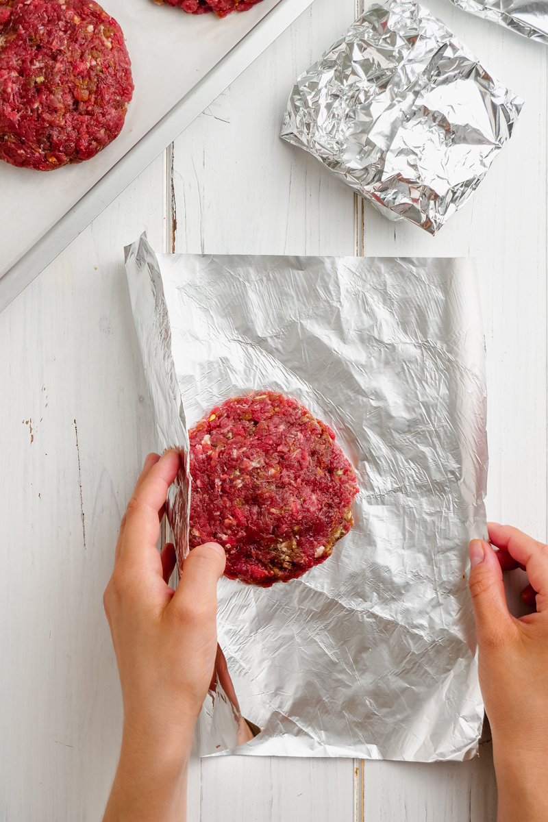 Wrapping hamburger patties with foil