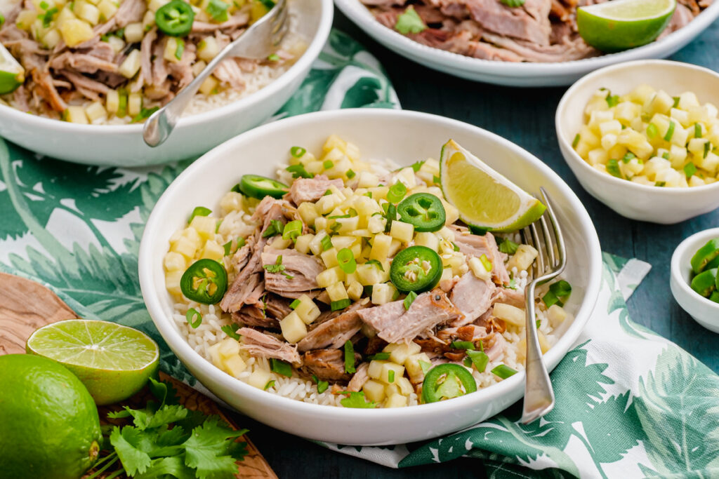 Kalua pork with pineapple salsa in a white bowl