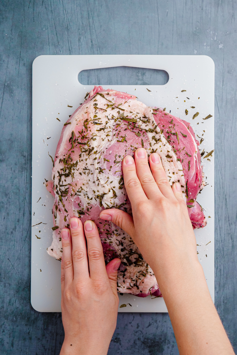 Rubbing pork with spice mixture