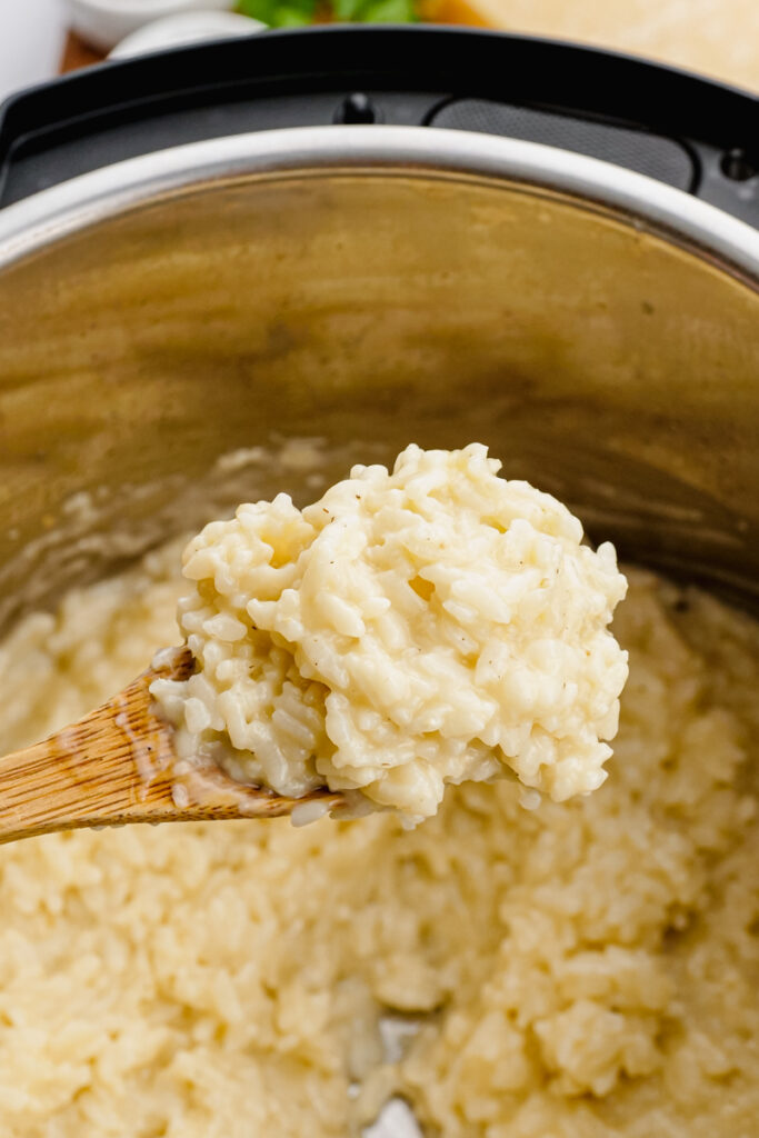 instant pot parmesan risotto in instant pot with wooden spoon