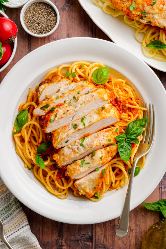 chicken pomodoro on a white plate with fork