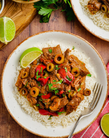 A white plate topped with ropa vieja