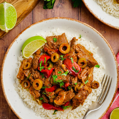 A white plate topped with ropa vieja