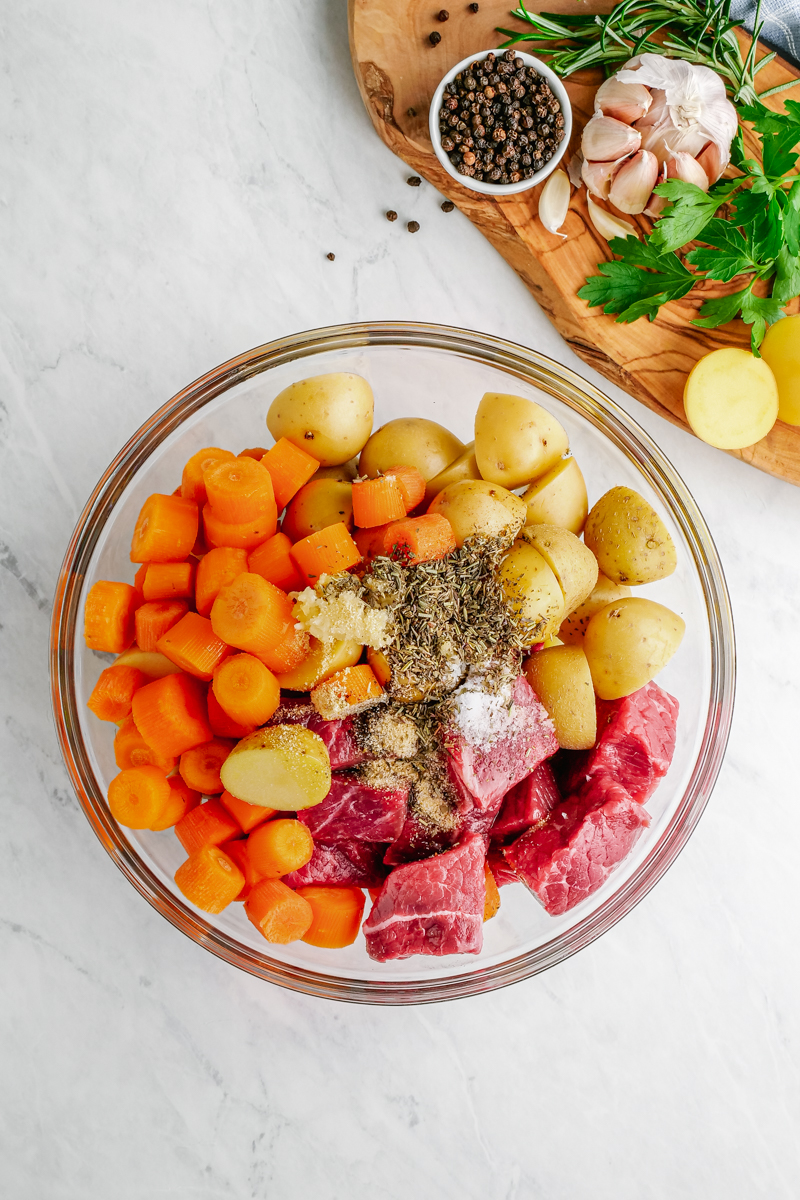 A bowl of ingredients for making steak and potato foil packs