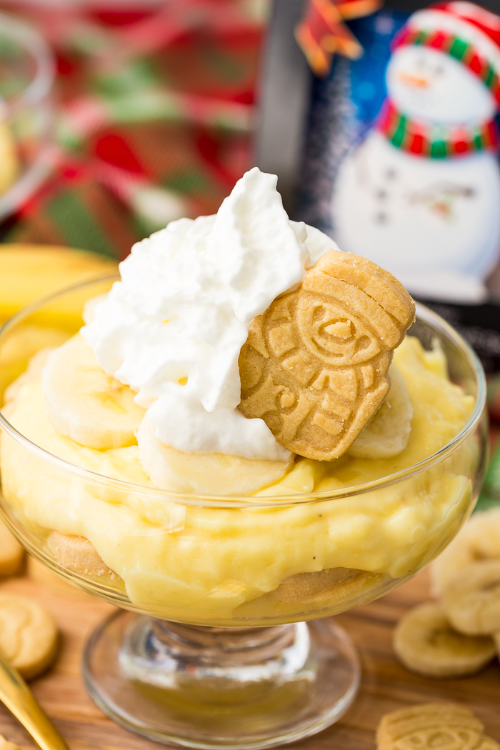 Holiday snowman walkers shortbread festive cookie on top of holiday banana pudding