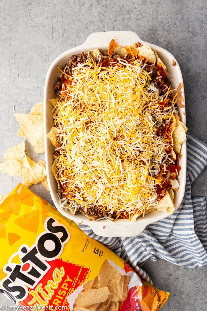 An unbaked enchilada casserole.