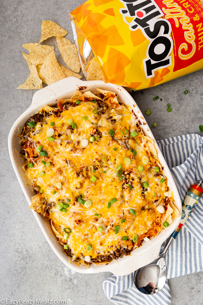 Enchilada casserole with an open bag of tostitos chips