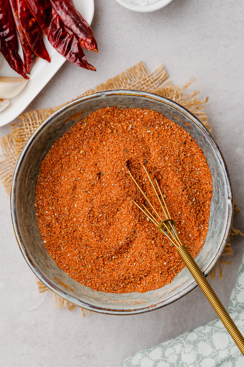 Mixing spices for oven roasted chicken thighs