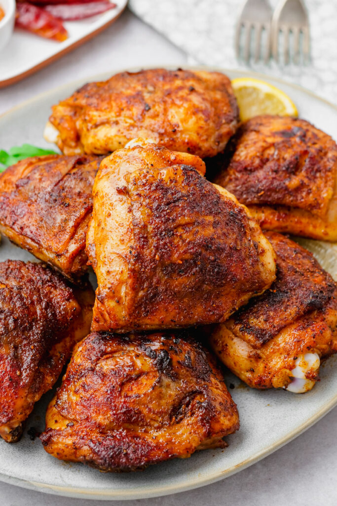 Chicken thighs, oven roasted after being seasoned with a rub. 