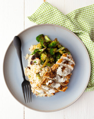 Chicken with Lemon Crema on a blue plate with a green napkin