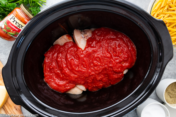 Slow Cooker Chicken Parmesan Casserole being made in the slow cooker.