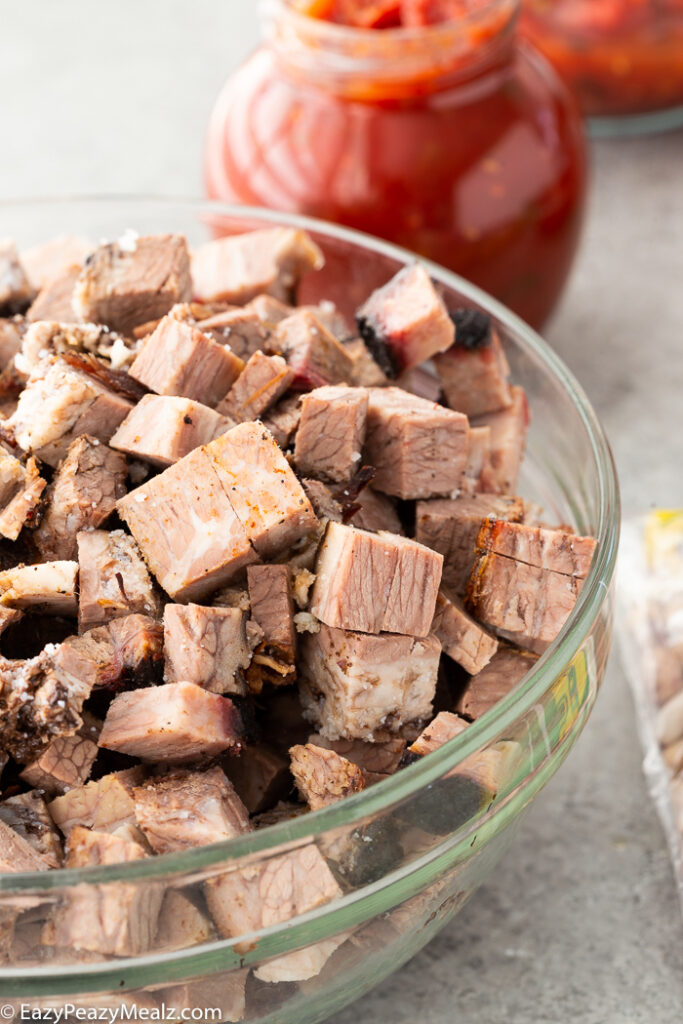 Leftover beef brisket cubed and in a bowl for beef brisket chili