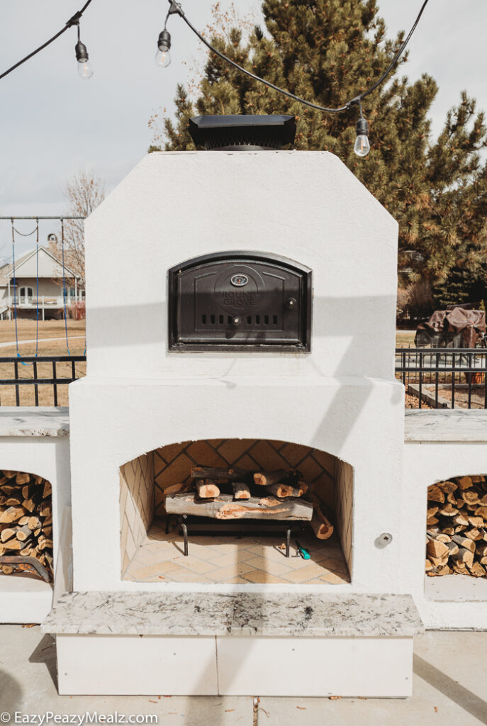 Round grove brick oven and fireplace combo