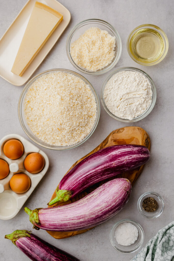 eggplant parmesan ingredients on cooking sheet