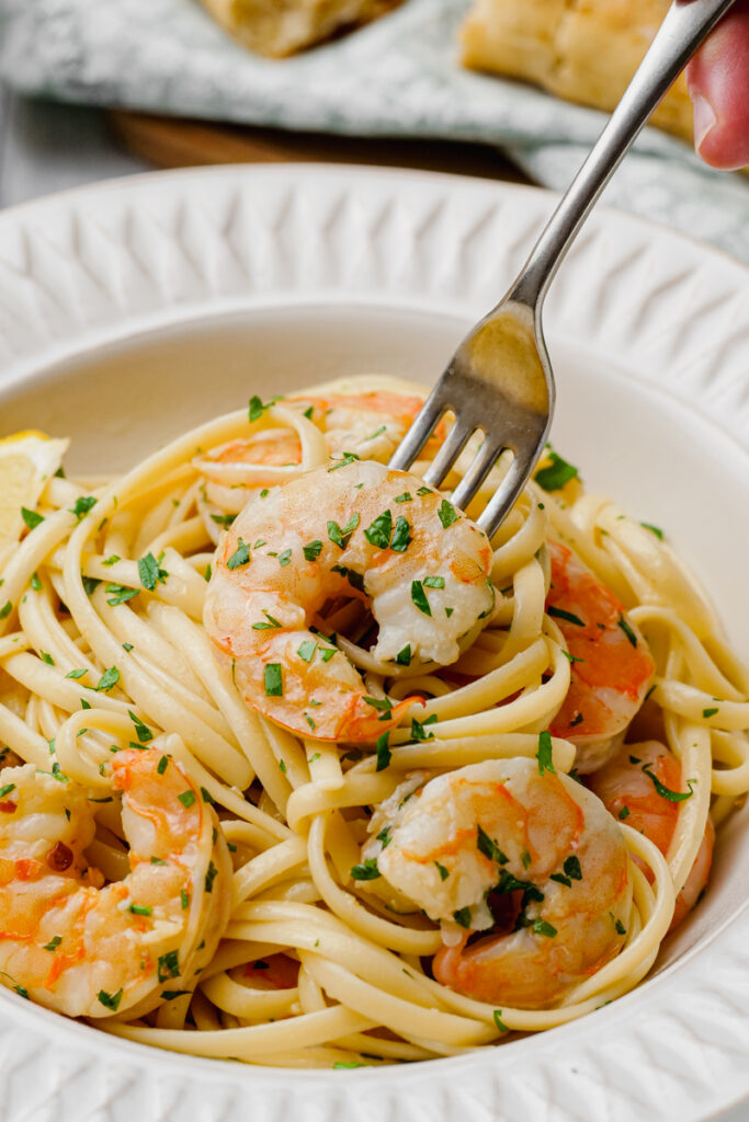 Shrimp scampi twisted around a fork