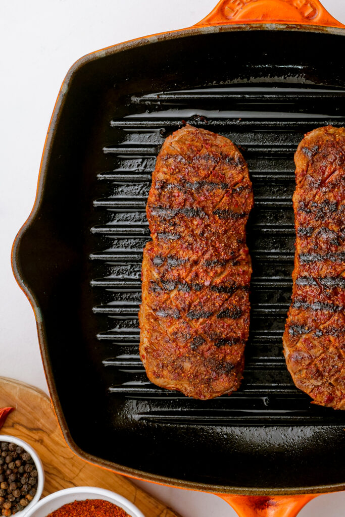 cooked sirloin steaks ready to rest before slicing