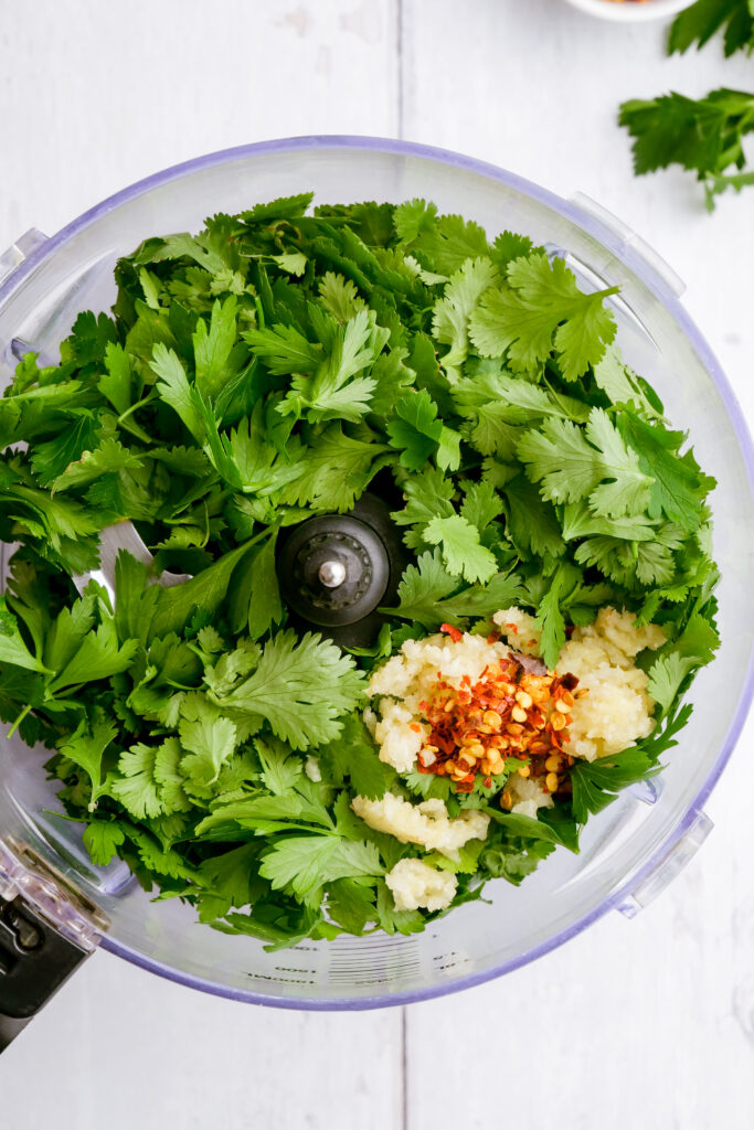 ingredients for chimichurri in a food processor