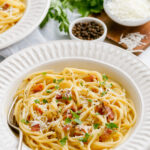 Spaghetti carbonara is a delicious spaghetti with bacon, eggs, and more.