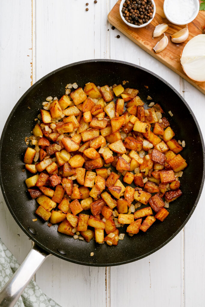 Home fries in a skillet, delicious golden potatoes