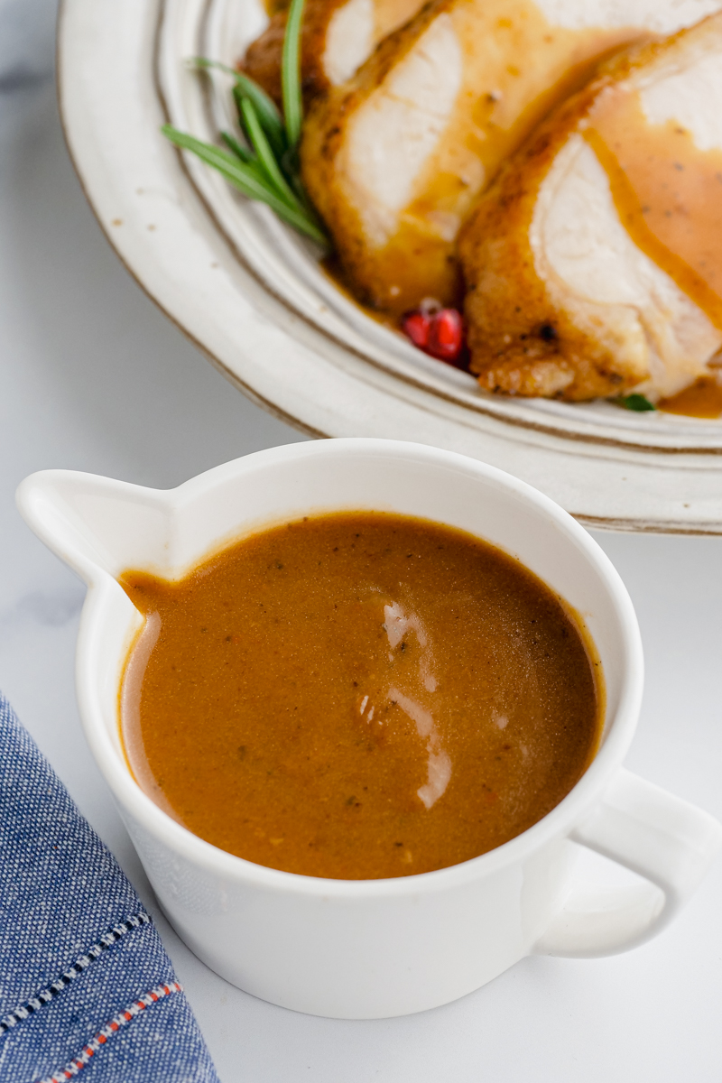 gravy from the juices in a white container