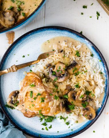 Creamy mushroom chicken on a blue plate