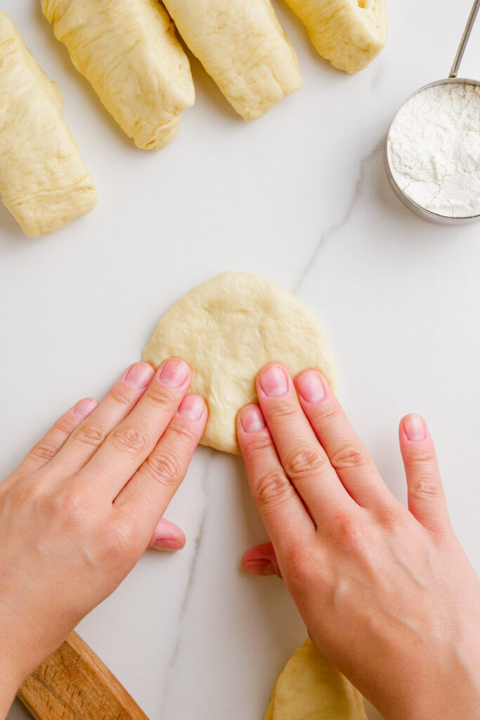 making parker house rolls, and shaping them