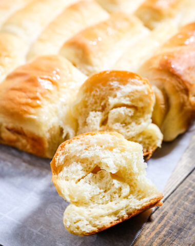 Seriously yummy Lion House rolls, these dinner rolls are on a baking sheet, and golden brown on top