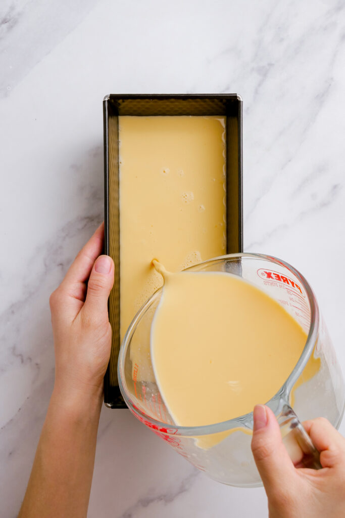 Preparing the flan in a loaf pan