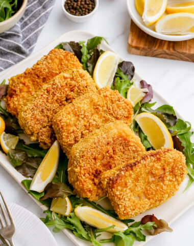 breaded pork chops on a platter