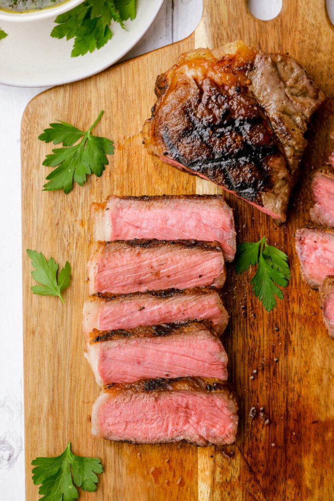 Slicing your strip steak for steak with chimichurri sauce