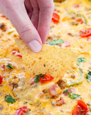Smoked queso cheese dip, a simple sausage beer cheese dip that you cook on a grill or smoker for ultimate flavor.