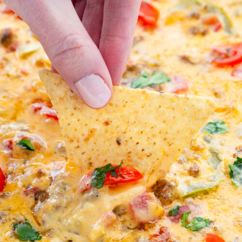 Smoked queso cheese dip, a simple sausage beer cheese dip that you cook on a grill or smoker for ultimate flavor.