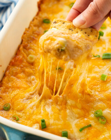 Texas trash dip, a warm bean dip that is full of flavor, and cheesy goodness.