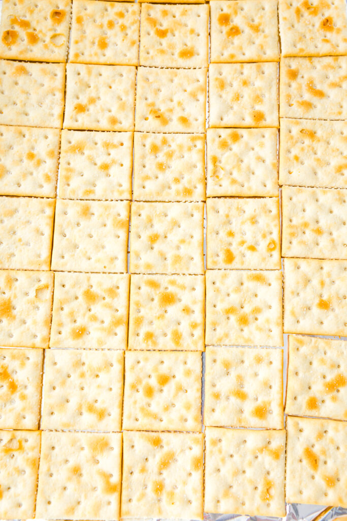 Lay Saltines out on a baking sheet covered in foil for Leprechaun Crack or Saltine Toffee