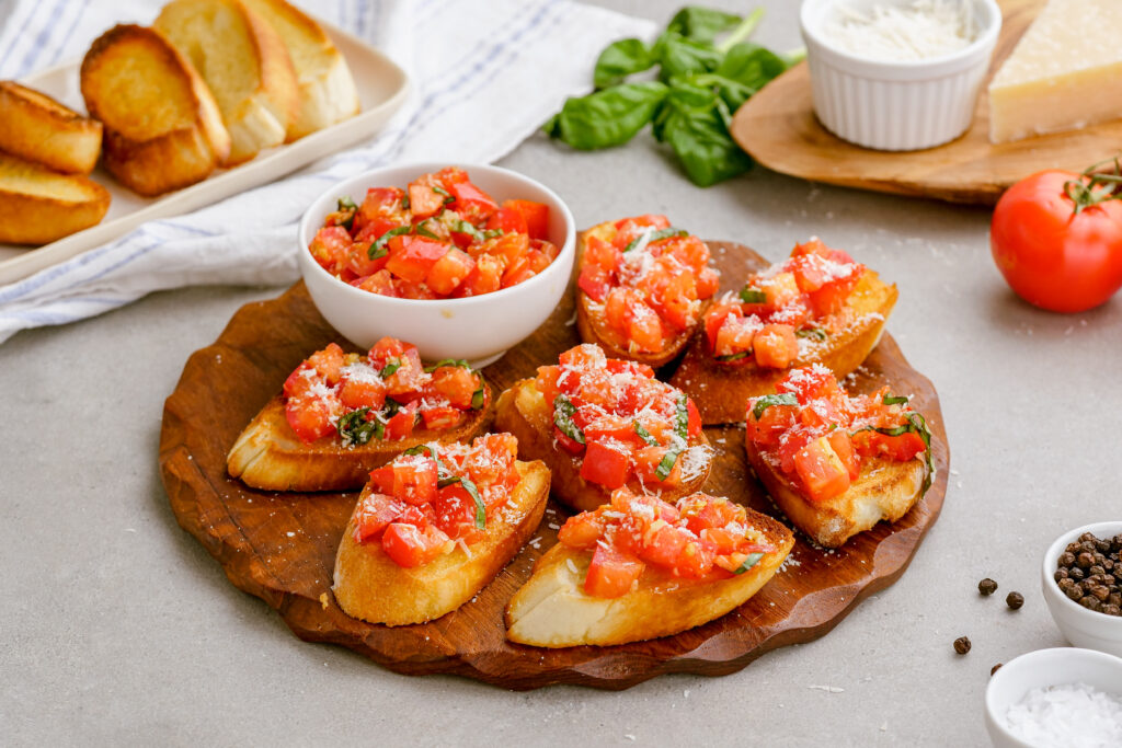 A platter of delicious bruschetta served with toasted baguettes