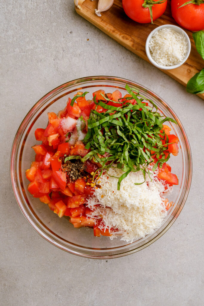 Making bruschetta, combinging all of the ingredients