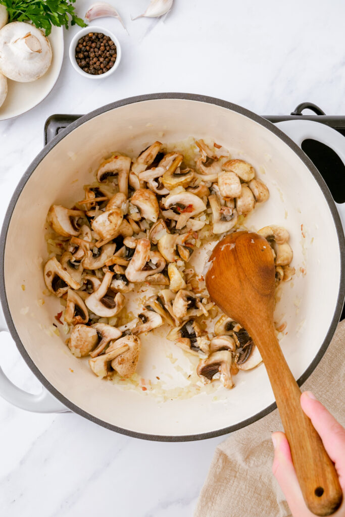 Cooking the ingredients for chicken fricassee