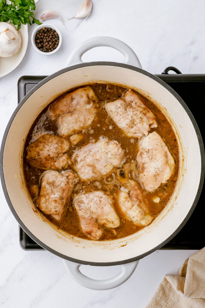 Adding chicken to the sauce for chicken fricassee