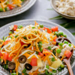 Easy to make Hawaiian haystacks, a creamy chicken gravy over rice loaded with toppings.